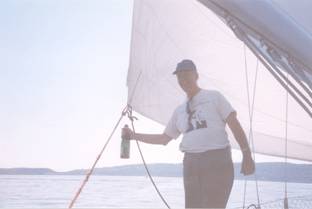 Skipper prepares to offer the annual libation to the river gods