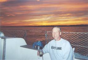 Skipper enjoys his own libation, while cruising in Long Island Sound